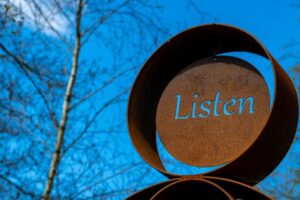 Listen carved into metal.